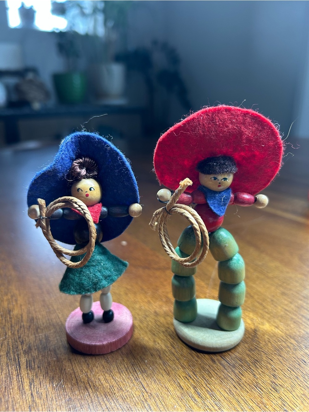 Lot of 2 wooden handmade dolls western cowboy cowgirl. Wood beads, felt hats.